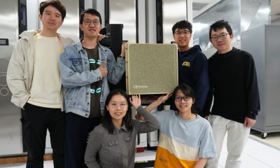 Researchers standing around the DGX B200 system inside the San Diego Supercomputing Center.